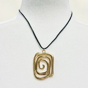 Gold spiral pendant necklace on black cord